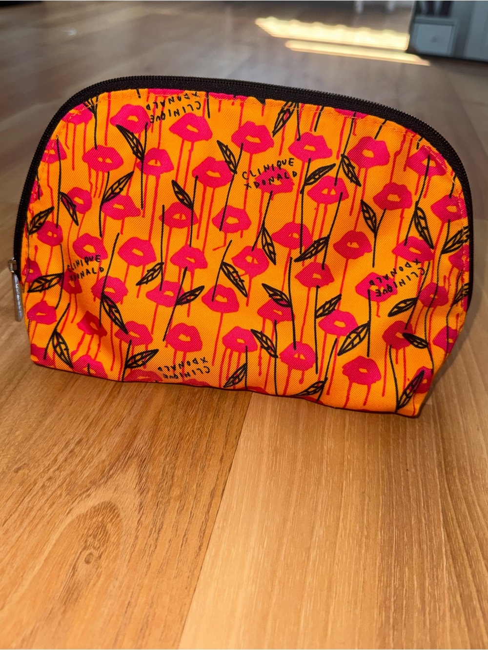 Clinique Orange Cosmetic Pouch with Pink Lip Print